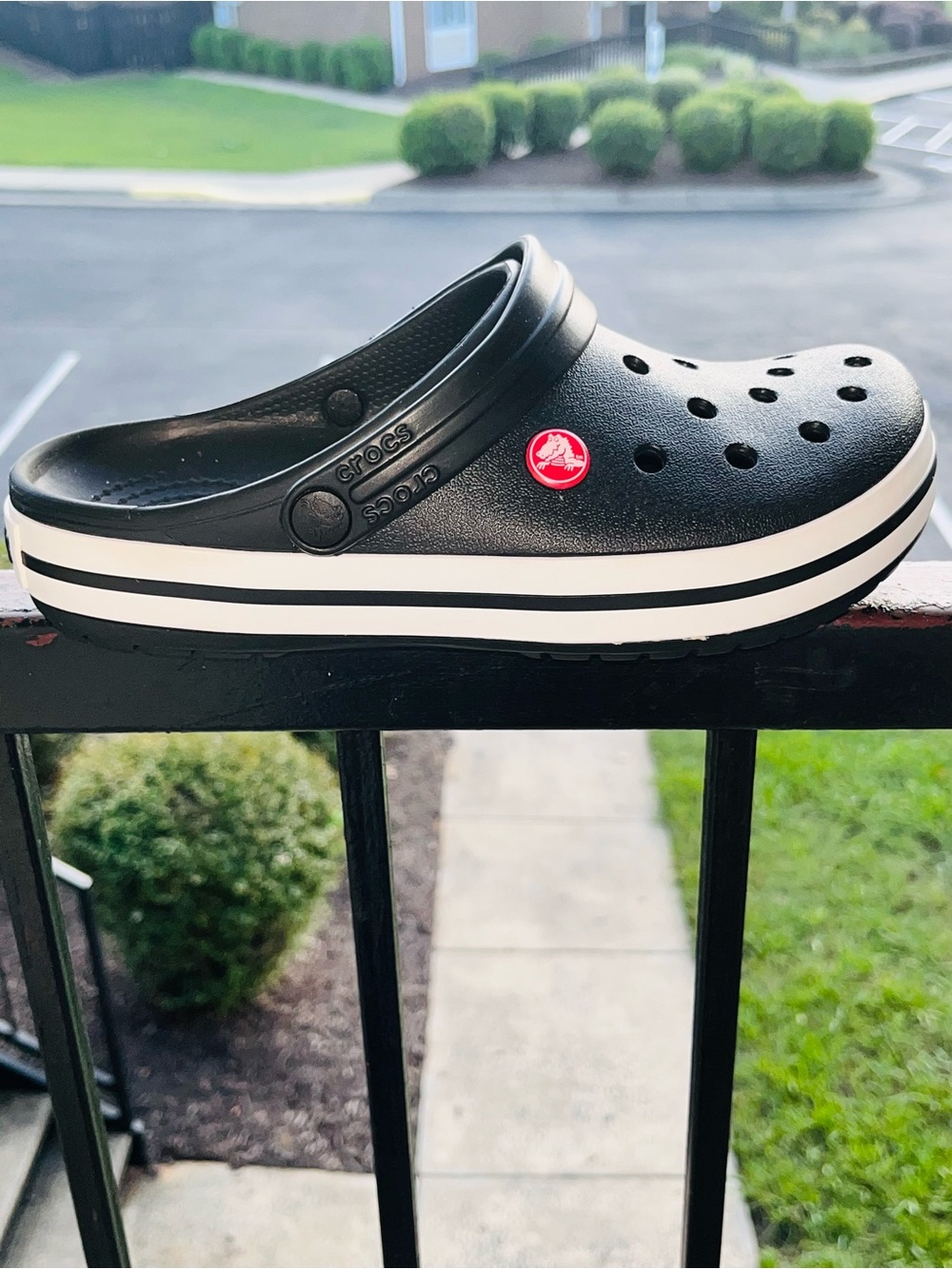 CROCS  womens Clog in Black with White Stripe and Red Logo